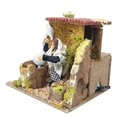 Donna che Spenna Galline Pastore per Presepe in Movimento 17x17 cm