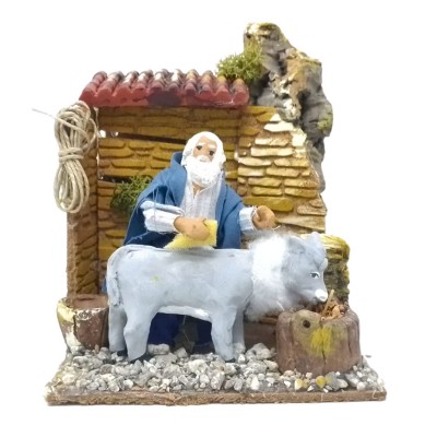 Uomo che Lava Asino Pastore per Presepe in Movimento 17x17 cm