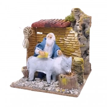 Uomo che Lava Asino Pastore per Presepe in Movimento 17x17 cm