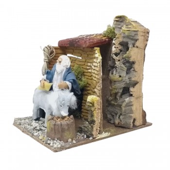 Uomo che Lava Asino Pastore per Presepe in Movimento 17x17 cm