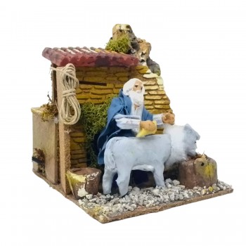 Uomo che Lava Asino Pastore per Presepe in Movimento 17x17 cm