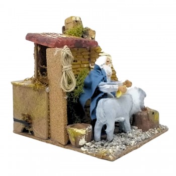 Uomo che Lava Asino Pastore per Presepe in Movimento 17x17 cm