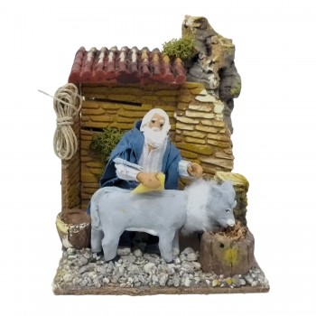 Uomo che Lava Asino Pastore per Presepe in Movimento 17x17 cm
