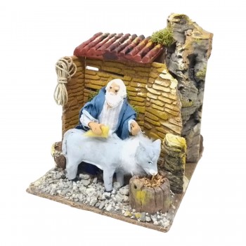 Uomo che Lava Asino Pastore per Presepe in Movimento 17x17 cm