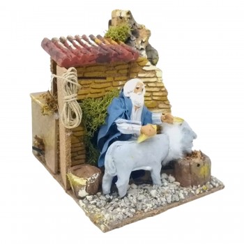 Uomo che Lava Asino Pastore per Presepe in Movimento 17x17 cm