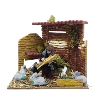 Bambino con Conigli Pastore per Presepe in Movimento 17x17 cm