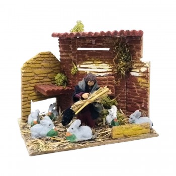 Bambino con Conigli Pastore per Presepe in Movimento 17x17 cm