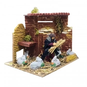 Bambino con Conigli Pastore per Presepe in Movimento 17x17 cm