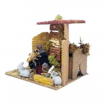 Bambino con Conigli Pastore per Presepe in Movimento 17x17 cm