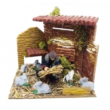 Bambino con Conigli Pastore per Presepe in Movimento 17x17 cm