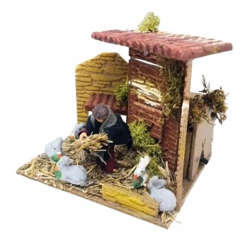 Bambino con Conigli Pastore per Presepe in Movimento 17x17 cm