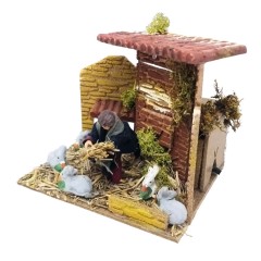 Bambino con Conigli Pastore per Presepe in Movimento 17x17 cm