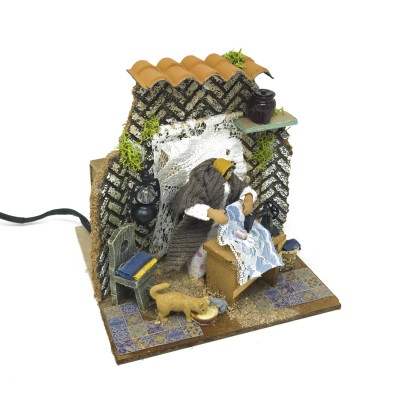 Donna che Cuce Pastore per Presepe in Movimento 17x17 cm 79218