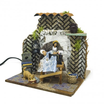 Donna che Cuce Pastore per Presepe in Movimento 17x17 cm 79218