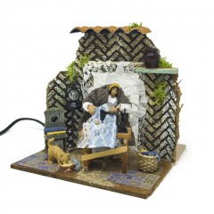Donna che Cuce Pastore per Presepe in Movimento 17x17 cm 79218