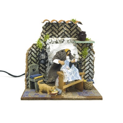 Donna che Cuce Pastore per Presepe in Movimento 17x17 cm 79218