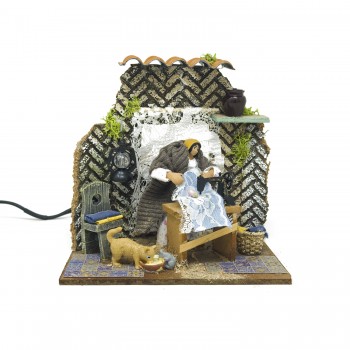 Donna che Cuce Pastore per Presepe in Movimento 17x17 cm 79218