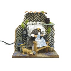 Donna che Cuce Pastore per Presepe in Movimento 17x17 cm 79218
