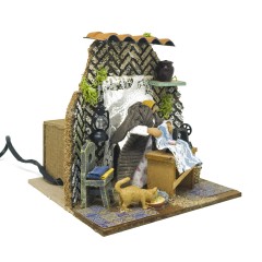 Donna che Cuce Pastore per Presepe in Movimento 17x17 cm 79218