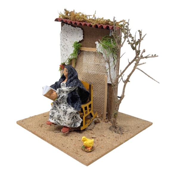 Donna che Legge Pastore per Presepe in Movimento 17x17 cm
