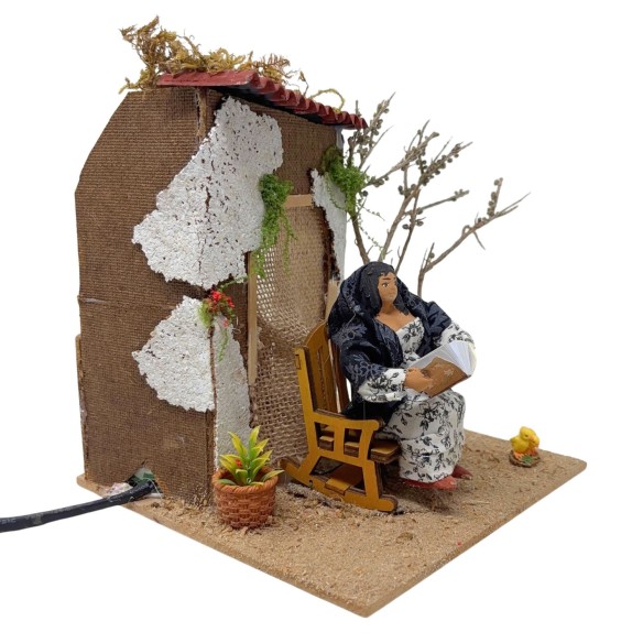 Donna che Legge Pastore per Presepe in Movimento 17x17 cm