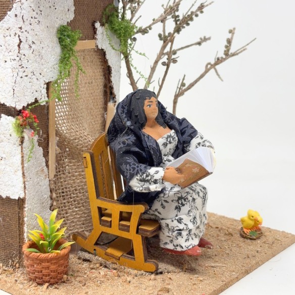 Donna che Legge Pastore per Presepe in Movimento 17x17 cm