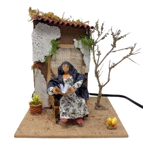 Donna che Legge Pastore per Presepe in Movimento 17x17 cm