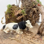 Mucca Seduta Animali per Presepe in Movimento 17x17 cm